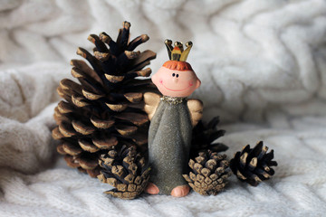 Christmas angel among the pine cones
