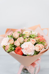 Beautiful spring bouquet . Arrangement with various flowers. The concept of a flower shop. A set of photos for a site or catalogue. Work florist.