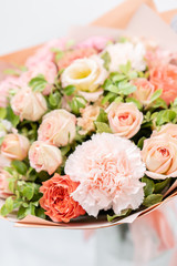 Beautiful spring bouquet . Arrangement with various flowers. The concept of a flower shop. A set of photos for a site or catalogue. Work florist.
