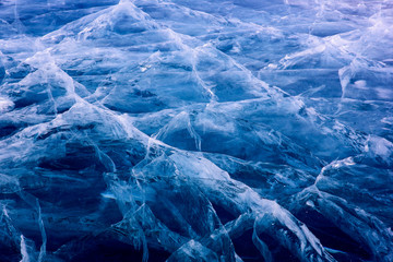 Blue cracked surface of the ice surface