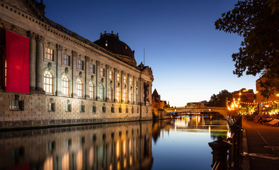 Museum illuminated, Spree river, museum island, Berlin, in the evening