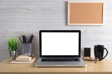 Mockup white screen laptop on table. workspace with blank screen laptop computer for graphic display montage