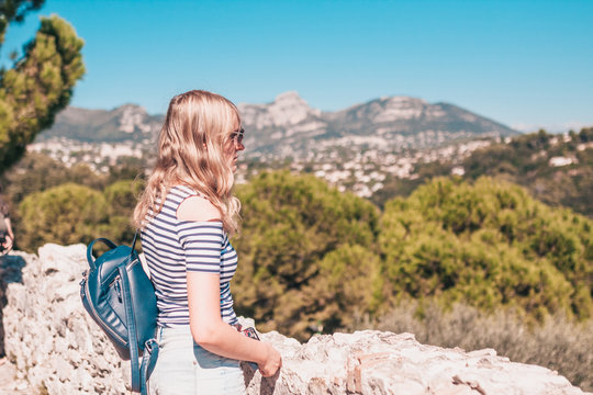 Attractive fashionable cute blonde on the background of sunny Provence