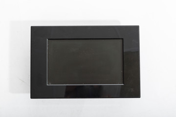 Old black electronic photo frame isolated