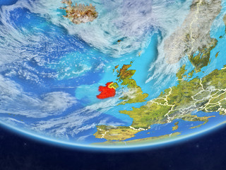 Ireland on realistic model of planet Earth with country borders and very detailed planet surface and clouds.