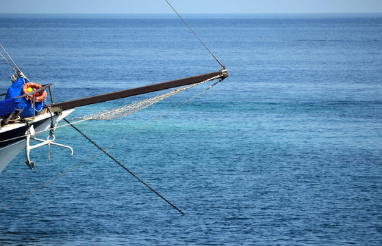 Puglia, Italy, the bowsprit of an italian sail boat moored in a bay of Tremiti islands.