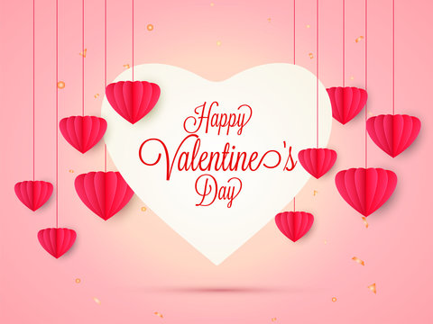 Happy Valentine's Day greeting card design decorated with red paper origami hearts hang on shiny pink background.