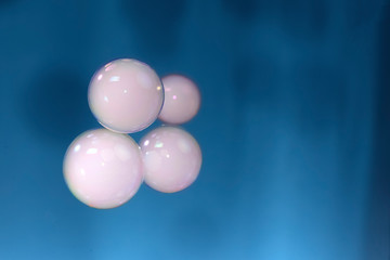 soap bubbles with smoke on blue  background
