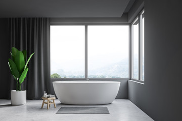 Fototapeta na wymiar Gray bathroom interior, tub and window