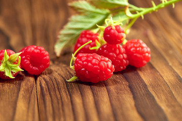 raspberry on a branch on a wooden table