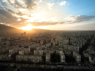 Beautiful sunset over Sofia, the capital of Bulgaria. Urban residential buildings and a part of Vitosha mountain in the background. 