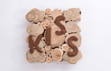 word kiss cookies in the wooden plate