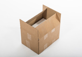 Open cardboard box with sticky tape