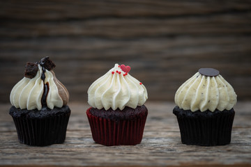 Tasty mini cupcakes on a vintage background, sweet dessert for christmas, new year and valentine holliday