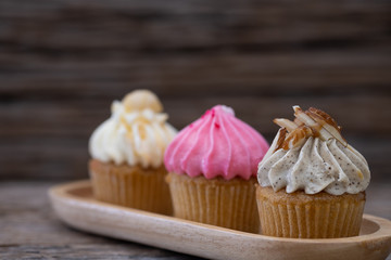 Tasty mini cupcakes on a vintage background, sweet dessert for christmas, new year and valentine holliday
