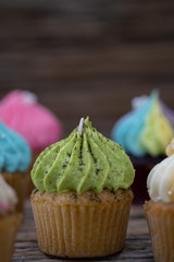 Tasty mini cupcakes on a vintage background, sweet dessert for christmas, new year and valentine holliday