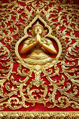 close up of carved door in buddhist temple