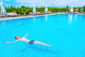 Man swimming in the pool.