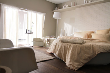 round bed in beige bedroom 2