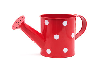 red polka dot watering can isolated on white