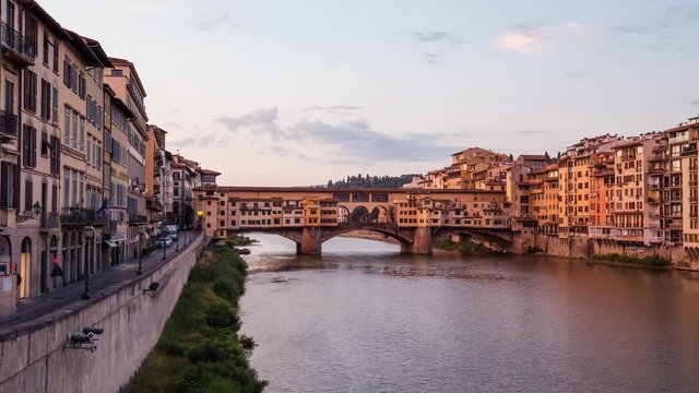 Sunrise over Ponte Vecchio in Florence, Italy, on a summer day. Colorful travel background. 4K time lapse. 