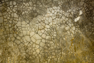 Old gray concrete wall with cracks in the dirt stains. mold on the wall
