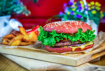 marbled beef burger with potato wedges
