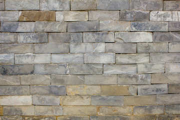 smooth wall of marble bricks. stone texture. gray stone wall