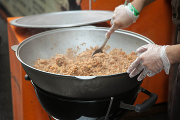 Cooking Uzbek pilaf at a food festival