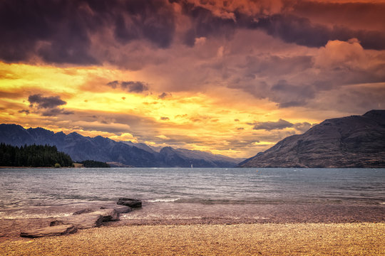 the Lake Te Anau in New Zealand at sunset