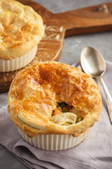 Chicken pot pie with carrot, grean peas and cheese.
