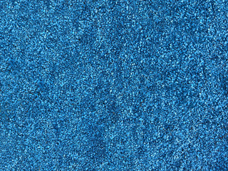 blue texture of the pebbles, colored background stones. Pile of stones, close-up of the blue pebbles, blue rocks for background or texture.