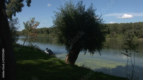 3 In 1 Water Meter And Boat On A River Surrounded By Green