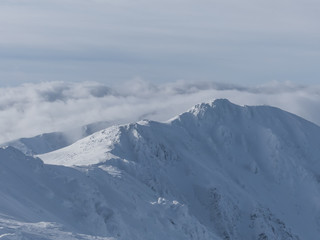 Fototapeta na wymiar View of the snowy peaks and slopes of the mountains Low Tatras, Slovakia.