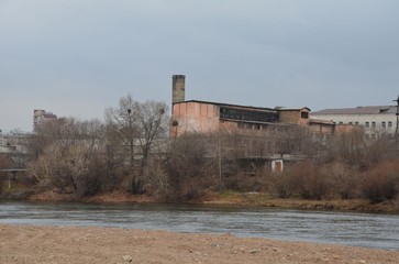 An old factory building with river foreground
