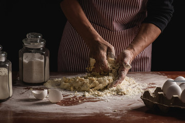 woman preparing dough with her hands