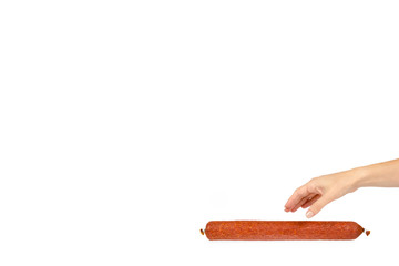 smoked salami sausage piece with hand, isolated on white background, copy space template