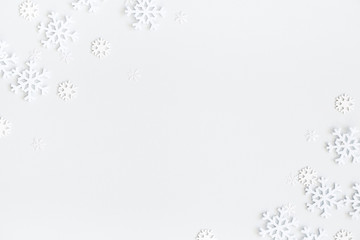 Christmas composition. Christmas frame made of snowflakes on pastel gray background. Winter...