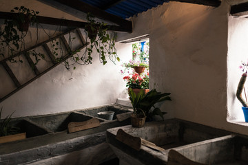 Ancient laundry room in cordoba, spain with wooden washboards
