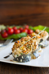 White fish rolls stuffed with crab meat and onions