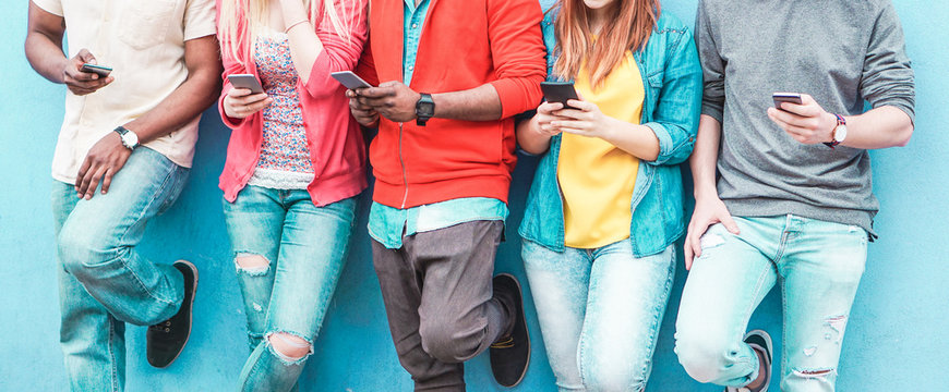 Group of friends watching smart mobile phones