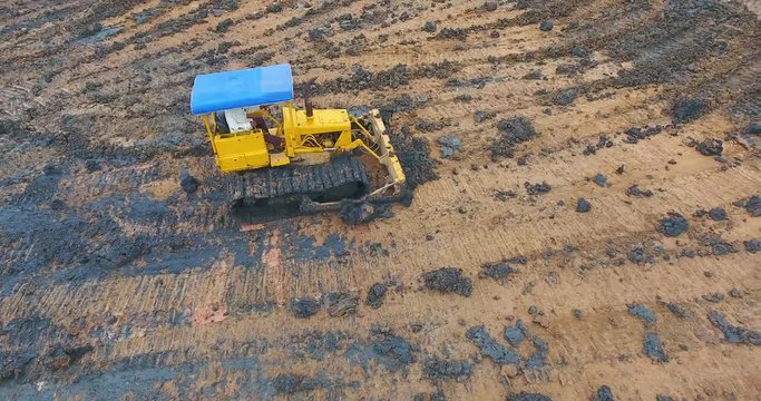 Yellow excavator or bulldozer works 1