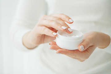 Hand Skin Care. Close Up Of Female Hands Holding Cream Tube, Beautiful Woman Hands With Natural Manicure Nails Applying Cosmetic Hand Cream On Soft Silky Healthy Skin