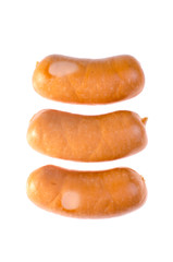 Lined in a row of smoked sausages isolated on white background.