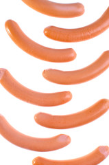 Lined in a row of smoked sausages isolated on white background.