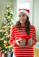 Young woman holding gift box