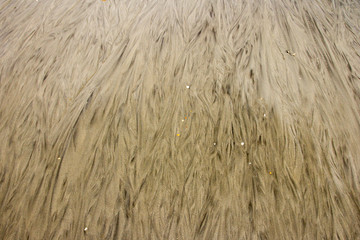 Patterns in sand after a storm on a beach 