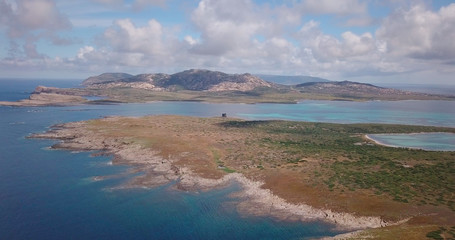 Drone footage, a beautiful day. Panoramas of the coasts of Sardinia, Italy. Stintino, La Pelosa and Asinara.