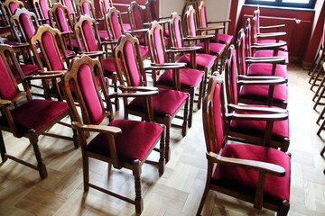 Hall of performances with empty red chairs