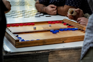 street backgammon, red and blue chips.